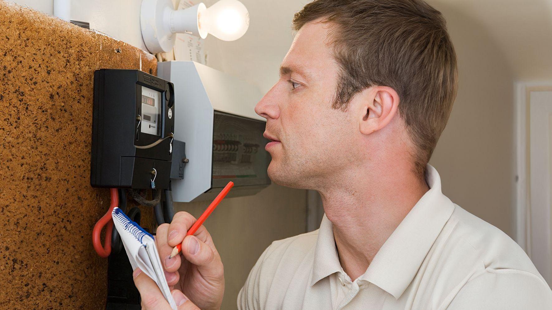 Man looking at meter