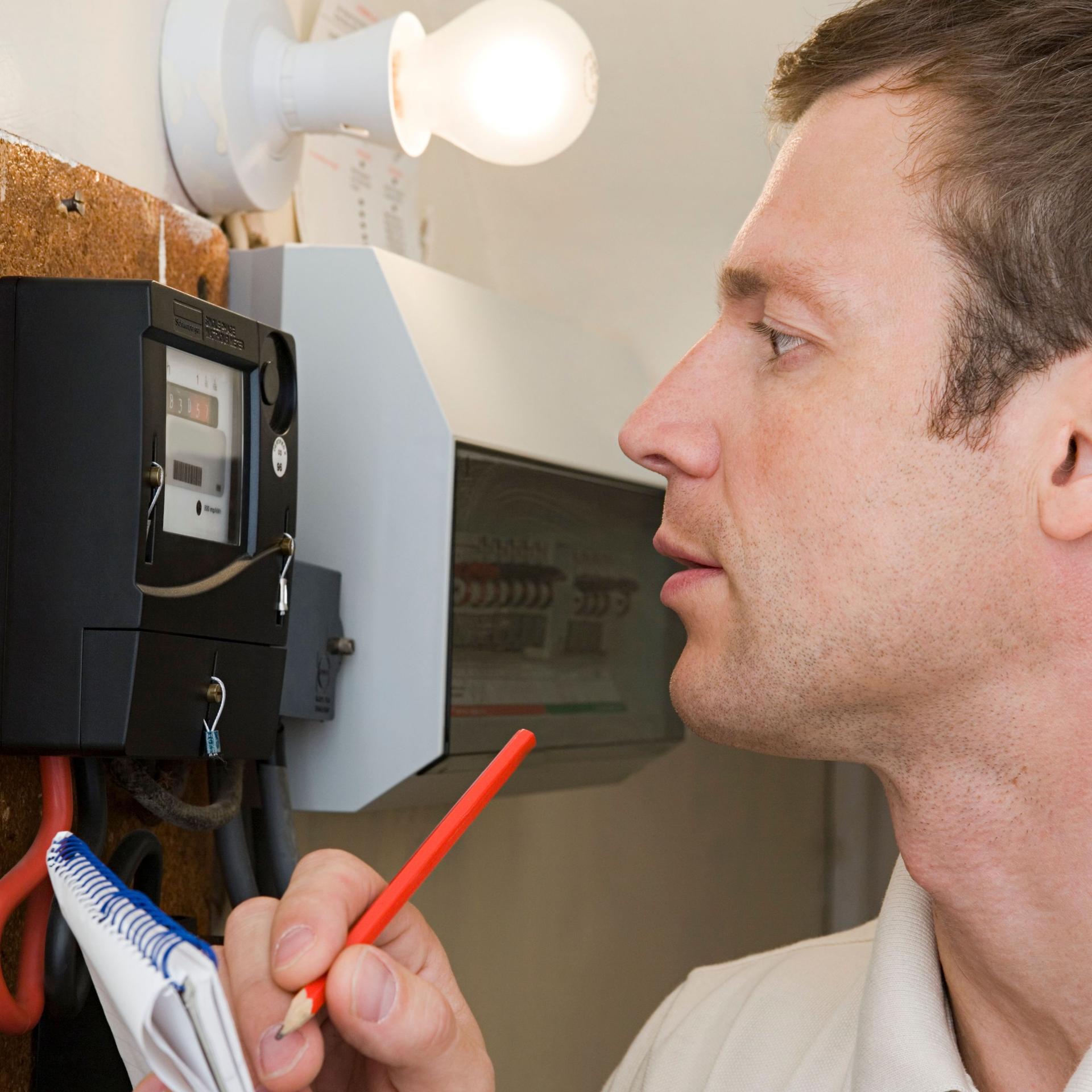 Man looking at meter