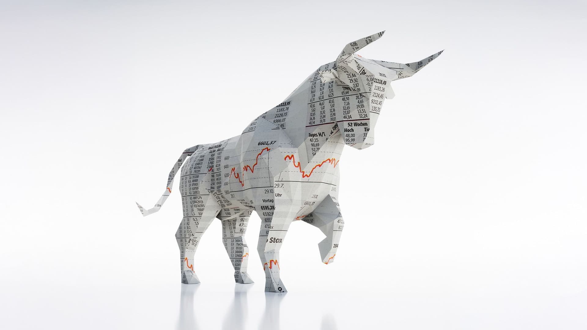 Börsenbulle aus Papier. Auf dem Papier befinden sich Aktienwerte und Börsenkurven.
